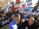 Former Utah Gov. Jon Huntsman makes his way through the media as he leaves a polling station in Manchester, N.H., on Tuesday. He's one of the candidates young Mormons are often asked about as they proselytize. Former Utah Gov. Jon Huntsman makes his way through the media as he leaves a polling station in Manchester, N.H., on Tuesday. He's one of the candidates young Mormons are often asked about as they proselytize.