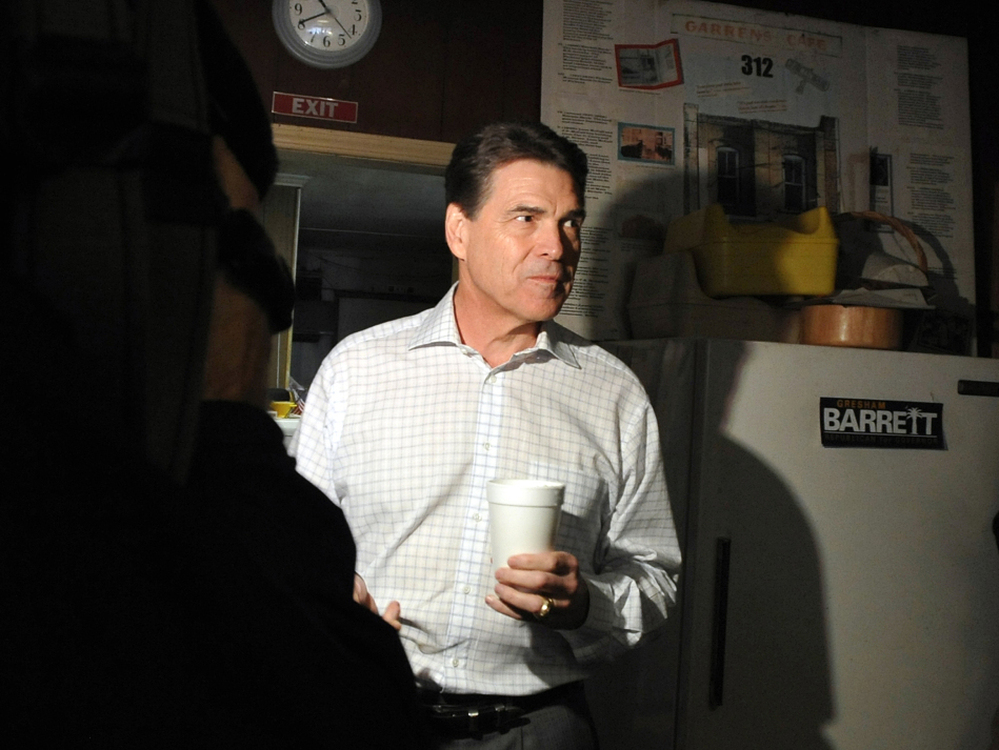 Texas Gov. Rick Perry campaigns in South Carolina on Jan. 9. Perry is suing Virginia to get his name on its March 6 primary ballot. 