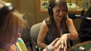 Janice Oeffner places a ring on the finger of Dawn Williams during an on-air proxy wedding between Williams and a Texas inmate. On-air proxy weddings have become so common that The Prison Show has a wedding coordinator to help guide couples through the paperwork.