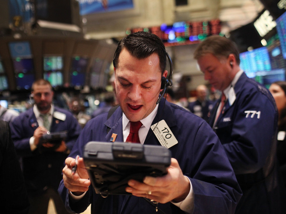 NEW YORK, NY - DECEMBER 20: Traders work on the floor of the New York Stock Exchange on December 20, 2011 in New York City. 