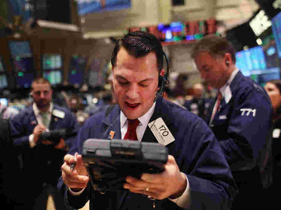 NEW YORK, NY - DECEMBER 20: Traders work on the floor of the New York Stock Exchange on December 20, 2011 in New York City. 