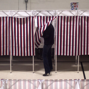 Voters cast ballots in the gym of the Webster School in Manchester, N.H., on Tuesday.