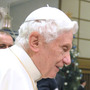 Pope Benedict XVI will travel in March to Cuba, where he's expected to endorse the growing dialogue between the church and the state. Here, an employee from the Rome's Biopark zoo holds a rare Cuban crocodile Wednesday, as he meets the pontiff at the Vatican. The crocodile will be returned to Cuba around the time the pope visits the island.