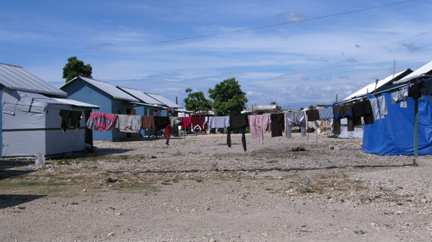  Seventy-three temporary wooden shelters were built last month by the American Red Cross together with other nongovernmental organizations in the Cite Soleil neighborhood of Port-au-Prince. Some residents of the new settlement, Village Carvil, have already added living space with tarps.
