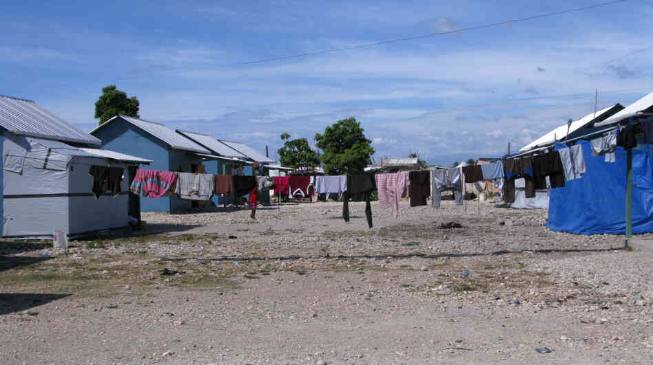 Seventy-three temporary wooden shelters were built last month by the American Red Cross together with other nongovernmental organizations in the Cite Soleil neighborhood of Port-au-Prince. Some residents of the new settlement, Village Carvil, have already added living space with tarps.
