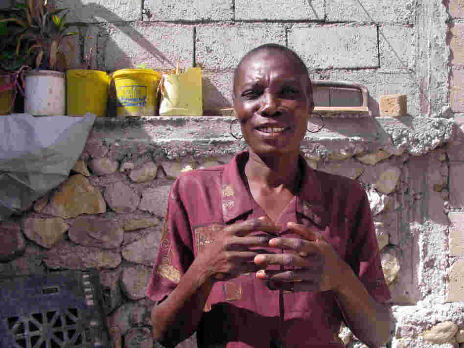 Elicia Andre, who says she used to be much larger — a sign of affluence in Haiti — is now skin and bones.