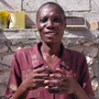 Elicia Andre, who says she used to be much larger — a sign of affluence in Haiti — is now skin and bones.