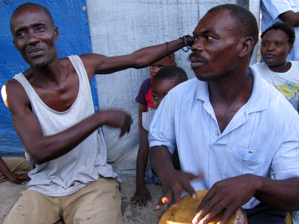 Pierre Jean Nelson (left) has lived at Champs de Mars, a camp for displaced people, since the quake hit. 
