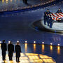 At the opening ceremony of the 2002 Winter Olympics in Salt Lake City, Mitt Romney (left) stands with President George W. Bush (center) and International Olympic Committee President Jacques Rogge (right) in front of the American flag that flew at the World Trade Center before the Sept. 11 terrorist attacks. At the opening ceremony of the 2002 Winter Olympics in Salt Lake City, Mitt Romney (left) stands with President George W. Bush (center) and International Olympic Committee President Jacques Rogge (right) in front of the American flag that flew at the World Trade Center before the Sept. 11 terrorist attacks.