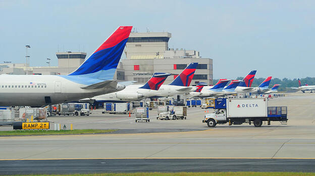 Delta Airlines planes line up at the terminal at Atlanta's Hartsfield-Jackson International Airport. Southwest Airlines will begin serving the city next month, and hope to lure passengers away from hometown airline, Delta. Delta Airlines planes line up at the terminal at Atlanta's Hartsfield-Jackson International Airport. Southwest Airlines will begin serving the city next month, and hope to lure passengers away from hometown airline, Delta.