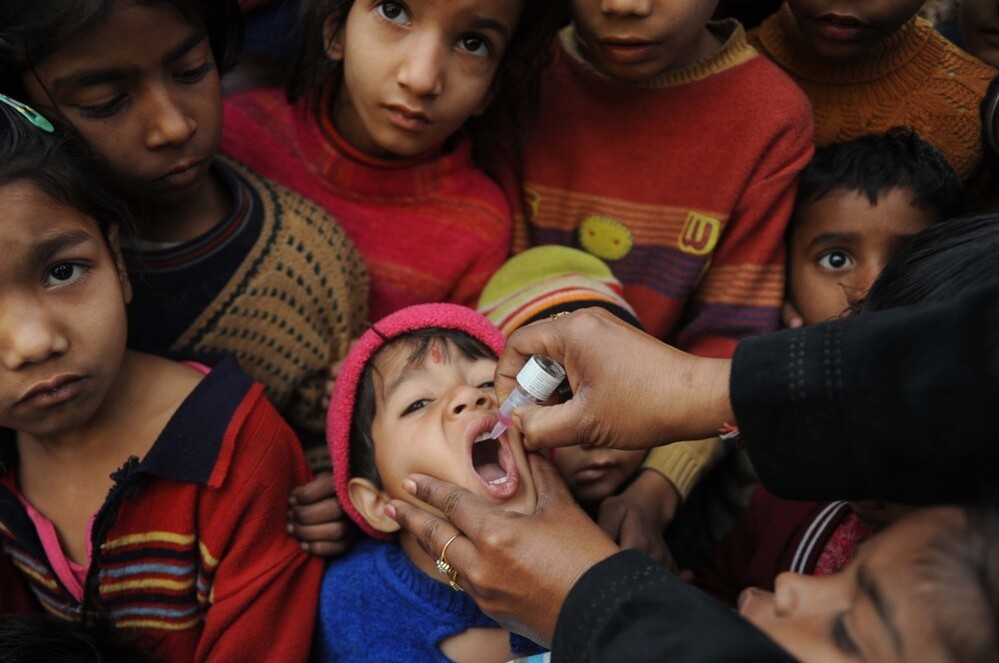 An Indian boy receives a polio vaccination from an Indian health worker in Amritsar last year.