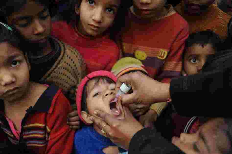 An Indian boy receives a polio vaccination from an Indian health worker in Amritsar last year.