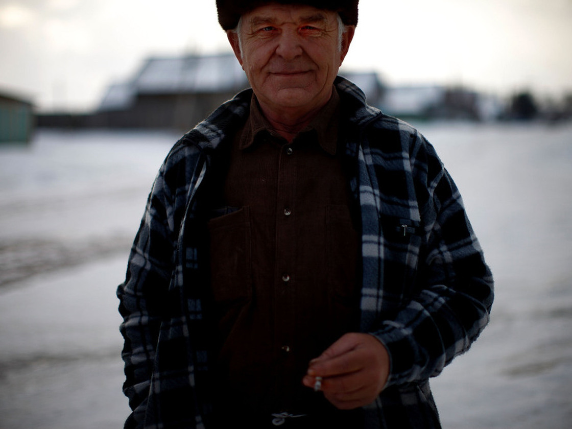Yuri Bronnikov, a former engineer, stands on the wintery shores of Lake Baikal in eastern Siberia.