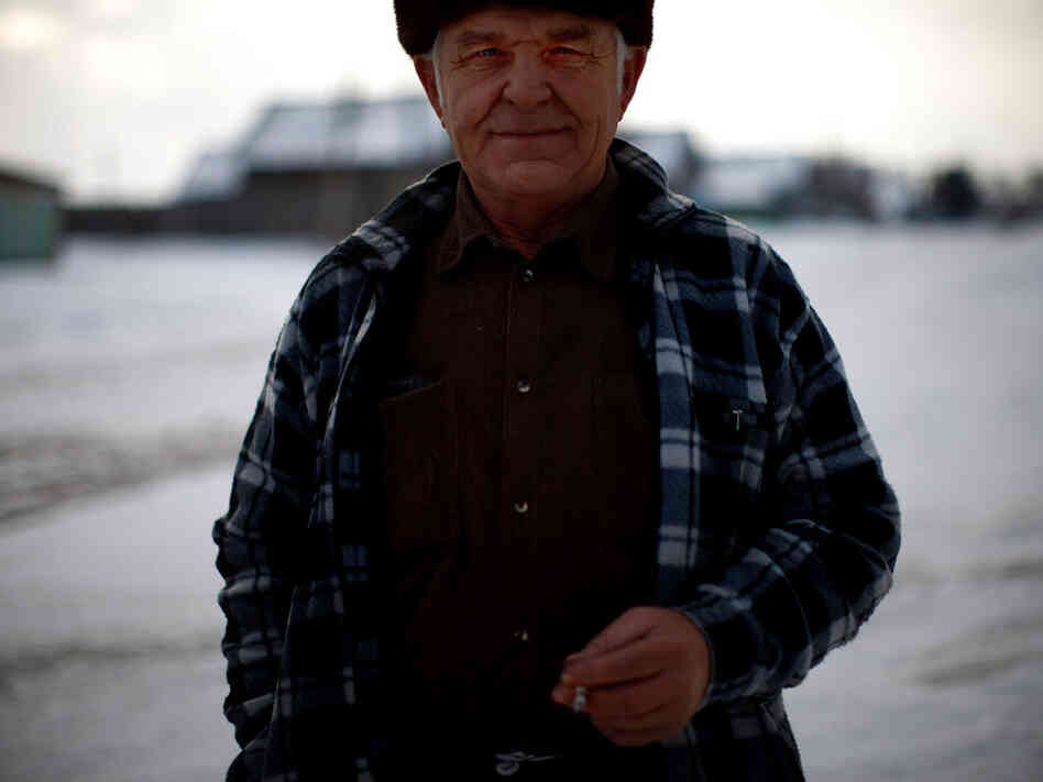 Yuri Bronnikov, a former engineer, stands on the wintery shores of Lake Baikal in eastern Siberia.