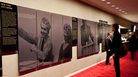 In better days, a New York City Opera attendee takes in a display about the beleagured company's rich history. In better days, a New York City Opera attendee takes in a display about the beleagured company's rich history.