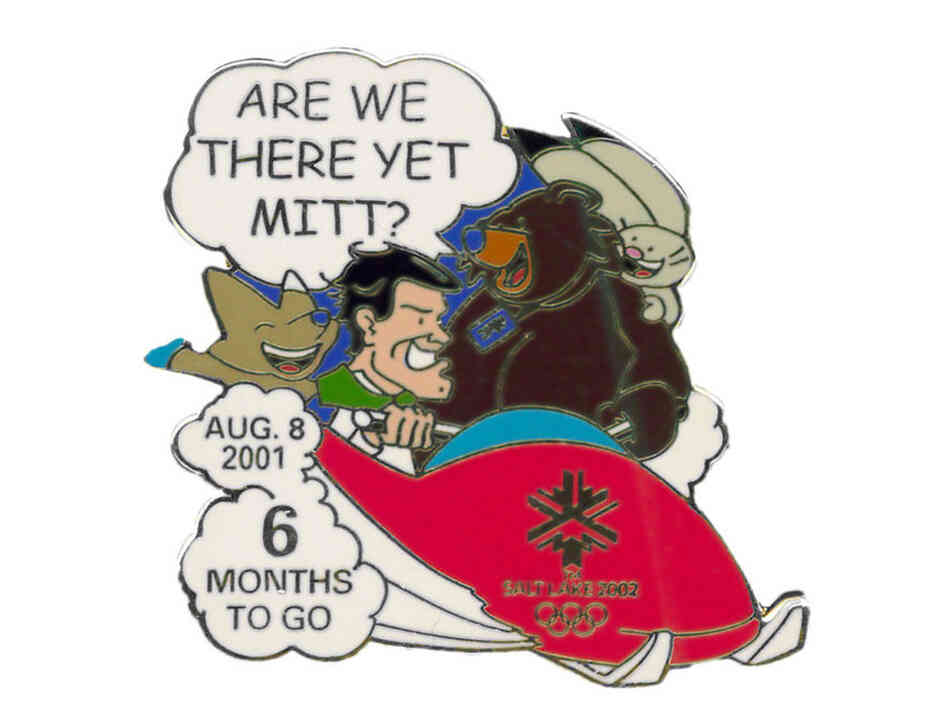 The "6 months to go" pin, with Romney driving a bobsled and the mascots asking, "Are we there yet?" 