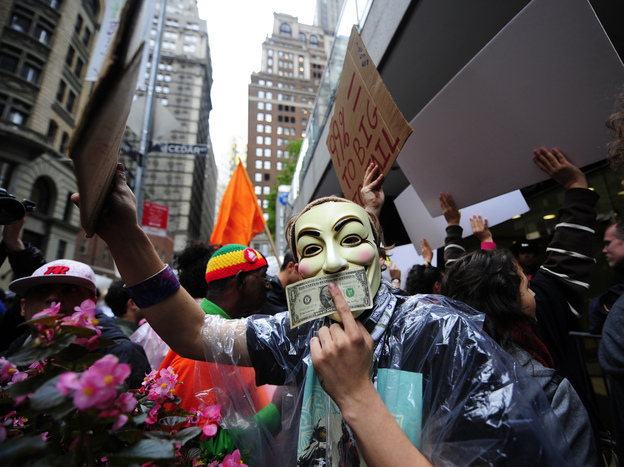 Occupy Wall Street members stage a protest march near Wall Street in New York in October. Paul Taylor of the Pew Research Center says the movement has "crystallized" the idea of economic disparity.