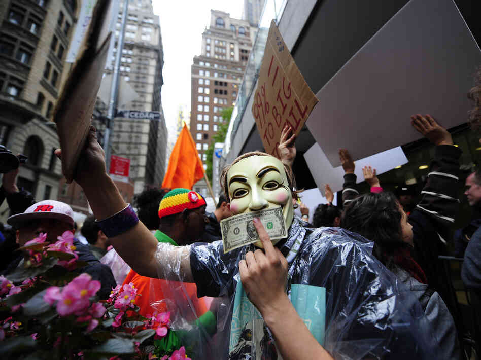 Occupy Wall Street members stage a protest march near Wall Street in New York in October. Paul Taylor of the Pew Research Center says the movement has "crystallized" the idea of economic disparity.
