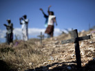 Relatives of those who died in the 2010 earthquake attend a memorial service at the mass grave site in Titanyen, on the outskirts of Port-au-Prince, Haiti, Thursday. Haitians are marking the second anniversary of the devastating 2010 earthquake with church services throughout the country on what is a national holiday of remembrance. Relatives of those who died in the 2010 earthquake attend a memorial service at the mass grave site in Titanyen, on the outskirts of Port-au-Prince, Haiti, Thursday. Haitians are marking the second anniversary of the devastating 2010 earthquake with church services throughout the country on what is a national holiday of remembrance.