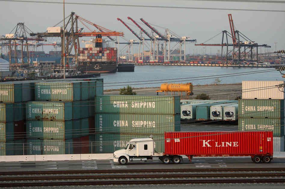 A truck passes shipping containers at China Shipping at the Ports of Long Beach and Los Angeles, the busiest port complex in the U.S., near Long Beach, Calif. Stricter emissions standards have cut down on air pollution from the trucks, which has been one of the most significant sources of air pollution in California for many years. A truck passes shipping containers at China Shipping at the Ports of Long Beach and Los Angeles, the busiest port complex in the U.S., near Long Beach, Calif. Stricter emissions standards have cut down on air pollution from the trucks, which has been one of the most significant sources of air pollution in California for many years.