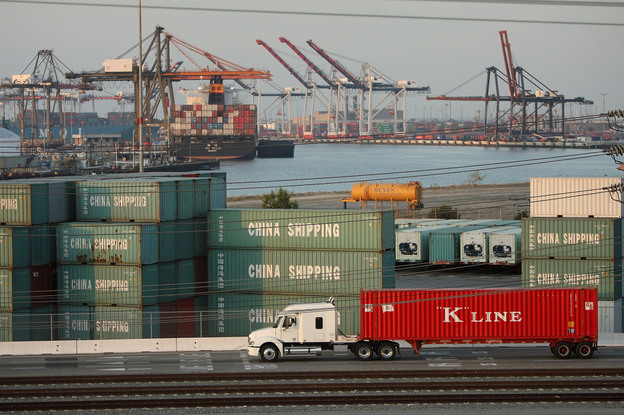 A truck passes shipping containers at China Shipping at the Ports of Long Beach and Los Angeles, the busiest port complex in the U.S., near Long Beach, Calif. Stricter emissions standards have cut down on air pollution from the trucks, which has been one of the most significant sources of air pollution in California for many years. A truck passes shipping containers at China Shipping at the Ports of Long Beach and Los Angeles, the busiest port complex in the U.S., near Long Beach, Calif. Stricter emissions standards have cut down on air pollution from the trucks, which has been one of the most significant sources of air pollution in California for many years.