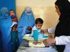 A nurse weighs an Afghan child at a U.S.-funded clinic in Farza, Afghanistan, in September. A new U.S.-sponsored survey shows dramatic gains in life expectancy and other aspects of health care in Afghanistan. But some experts are questioning the accuracy of the results. A nurse weighs an Afghan child at a U.S.-funded clinic in Farza, Afghanistan, in September. A new U.S.-sponsored survey shows dramatic gains in life expectancy and other aspects of health care in Afghanistan. But some experts are questioning the accuracy of the results.