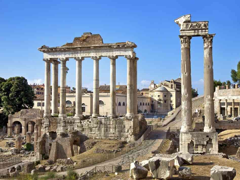 Ancient columns of the Temple of Saturn in the Roman Forum in Rome. Historians have noted that the Roman Empire expanded beyond its abilities to defend its borders.
