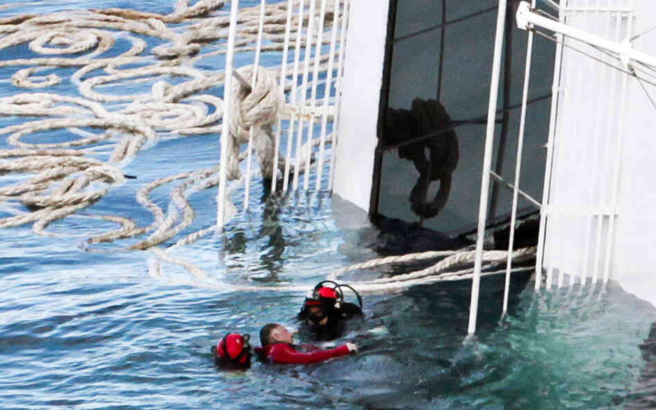 Rescuers exploded four holes in the hull of the ship to gain easier access to areas that had not yet been searched. Here, a scuba diver recovers a body Tuesday. 