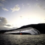 The Costa Concordia lies stranded in the Giglio harbor on Tuesday. The Costa Concordia lies stranded in the Giglio harbor on Tuesday.