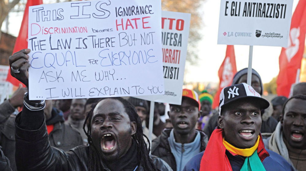 Immigrants from Senegal protest against racism in Florence, Italy, on Dec. 17, 2011. Four days earlier, an Italian man killed two African street sellers and wounded three others in a shooting spree in Florence.