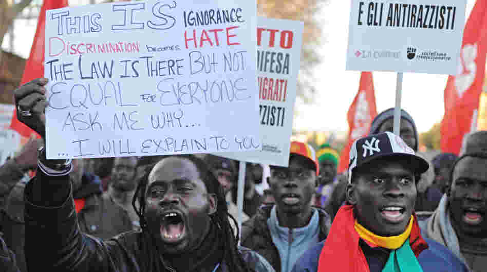 Immigrants from Senegal protest against racism in Florence, Italy, on Dec. 17, 2011. Four days earlier, an Italian man killed two African street sellers and wounded three others in a shooting spree in Florence.