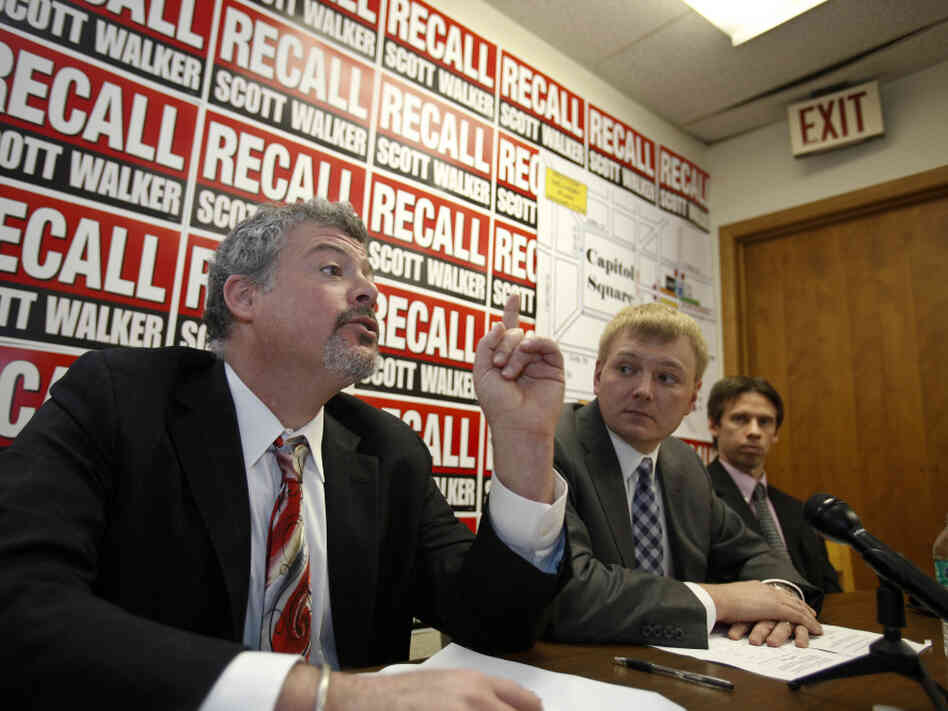 Jeremy Levinson, (l) a lawyer to the recall committees, talks about the petitions as Mike Tate (c)  Wisconsin Democratic Party chair listens, Tuesday, Jan. 17, 2012.