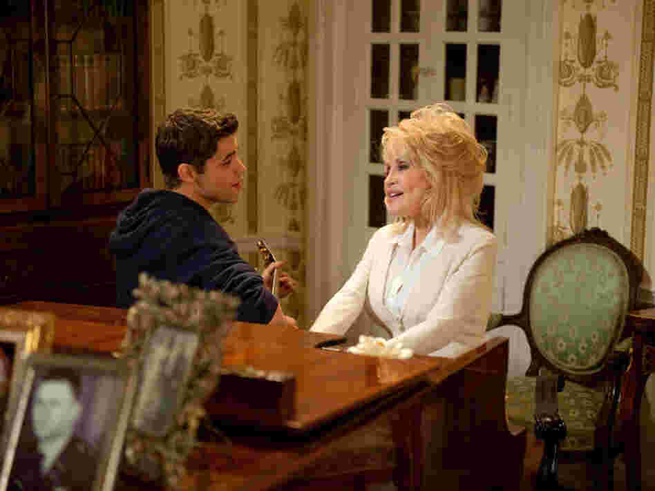 Dolly Parton and Jeremy Jordan sing "From Here to the Moon and Back," written by Parton.  