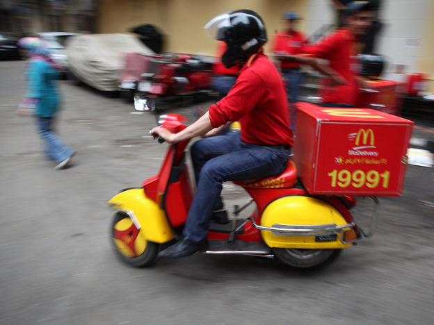 A Big Mac on two wheels? Egypt, pictured here, is one of 15 countries where the fast-food giant McDonald's delivers. 