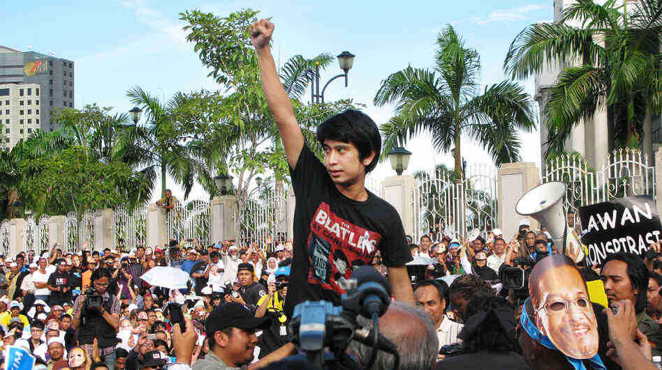 Student activist Adam Adli addresses protesters outside Malaysia's high court in Kuala Lumpur on Jan. 9. The crowd was awaiting a verdict in the trial of opposition leader Anwar Ibrahim, who was acquitted on charges of sodomy shortly afterward. Adam is leading the fight to abolish a decades-old law that bans college students from joining or speaking in support of political parties. Student activist Adam Adli addresses protesters outside Malaysia's high court in Kuala Lumpur on Jan. 9. The crowd was awaiting a verdict in the trial of opposition leader Anwar Ibrahim, who was acquitted on charges of sodomy shortly afterward. Adam is leading the fight to abolish a decades-old law that bans college students from joining or speaking in support of political parties.
