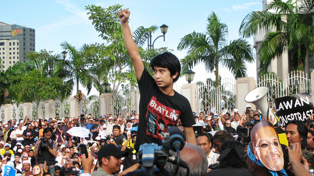 Student activist Adam Adli addresses protesters outside Malaysia's high court in Kuala Lumpur on Jan. 9. The crowd was awaiting a verdict in the trial of opposition leader Anwar Ibrahim, who was acquitted on charges of sodomy shortly afterward. Adam is leading the fight to abolish a decades-old law that bans college students from joining or speaking in support of political parties. Student activist Adam Adli addresses protesters outside Malaysia's high court in Kuala Lumpur on Jan. 9. The crowd was awaiting a verdict in the trial of opposition leader Anwar Ibrahim, who was acquitted on charges of sodomy shortly afterward. Adam is leading the fight to abolish a decades-old law that bans college students from joining or speaking in support of political parties.