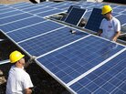 Contractors with SunEdison install more than 1,000 Chinese-made solar panels on top of a Kohl's Department Store in Hamilton Township, N.J., in 2010. Energy generated by the solar system will cut the store's usage, on average, by 25 to 30 percent. Contractors with SunEdison install more than 1,000 Chinese-made solar panels on top of a Kohl's Department Store in Hamilton Township, N.J., in 2010. Energy generated by the solar system will cut the store's usage, on average, by 25 to 30 percent.