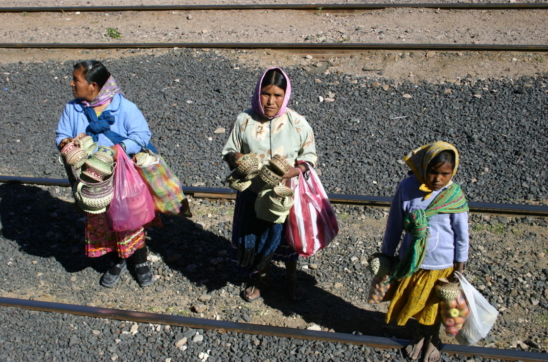 In this photo taken on Nov. 9, 2011, Tarahumara women are seen peddling goods to passengers of El Chepe, a government-run train.