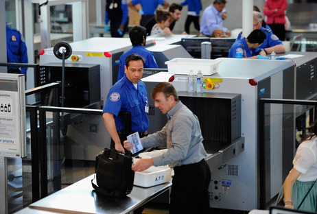 Transportation Security Administration (TSA) agents screen passengers at Los Angeles International Airport. Transportation Security Administration (TSA) agents screen passengers at Los Angeles International Airport.