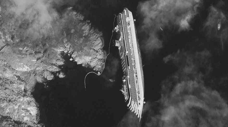 This satellite image taken Tuesday shows the hulk of the luxury cruise ship Costa Concordia, which ran aground off the tiny Tuscan island of Giglio. This satellite image taken Tuesday shows the hulk of the luxury cruise ship Costa Concordia, which ran aground off the tiny Tuscan island of Giglio.