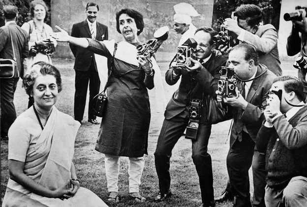 India's first female photojournalist, Homai Vyarawalla (center), seen with other press photographers at a photo session with Indira Gandhi in Delhi.