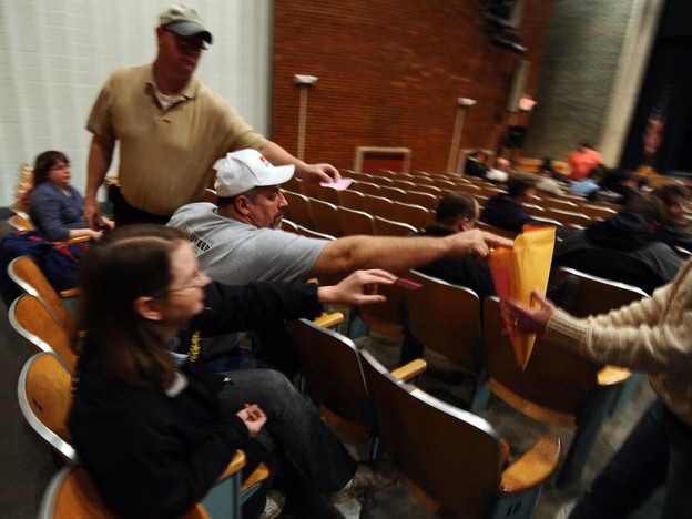 Iowa caucusgoers deposit their ballots on Jan. 3 at a school in Des Moines. On Thursday, the state GOP said it could not account for all votes from the caucuses.