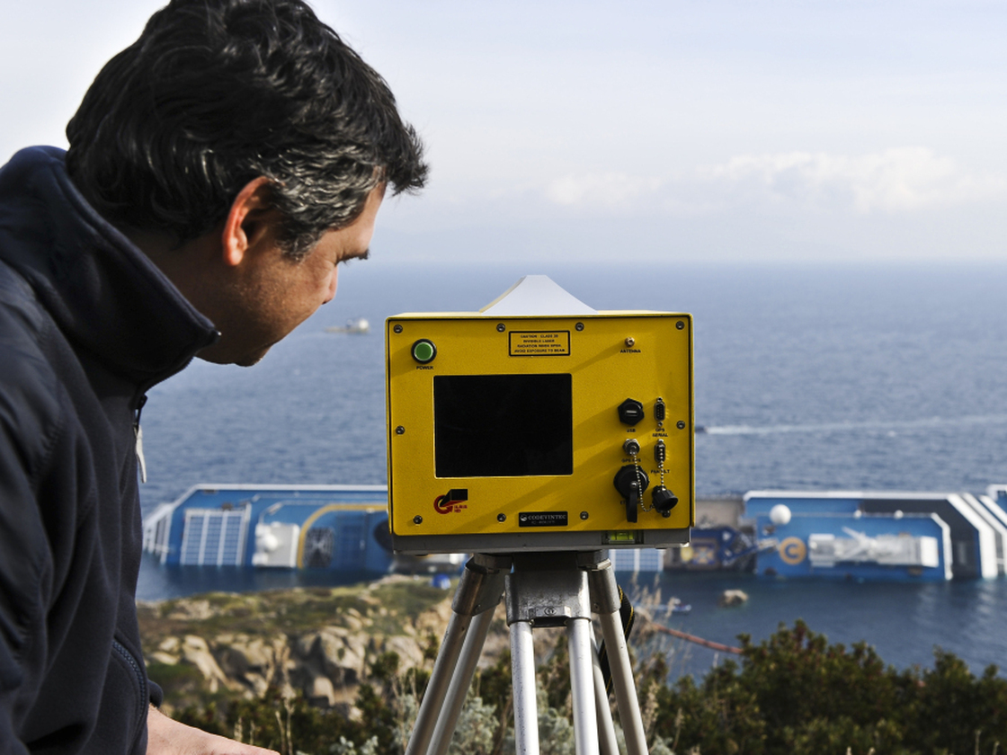 Technician Andera Faccioli positioned a laser-equipped device to determine whether the Costa Concordia has shifted position off the Tuscan island of Giglio, Italy.