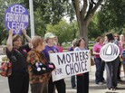 Protesters against new regulations limiting abortion rights rally outside the Statehouse in Topeka, Kan., last Sept. Protesters against new regulations limiting abortion rights rally outside the Statehouse in Topeka, Kan., last Sept.