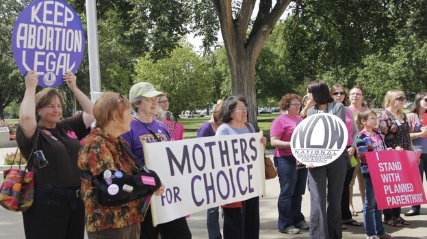 Protesters against new regulations limiting abortion rights rally outside the Statehouse in Topeka, Kan., last Sept.