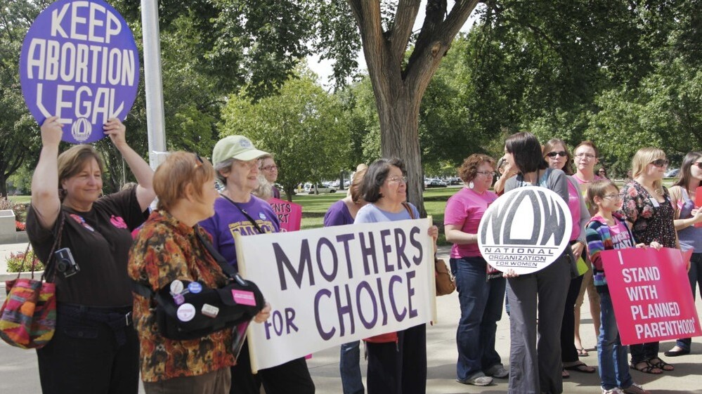Protesters against new regulations limiting abortion rights rally outside the Statehouse in Topeka, Kan., last Sept.