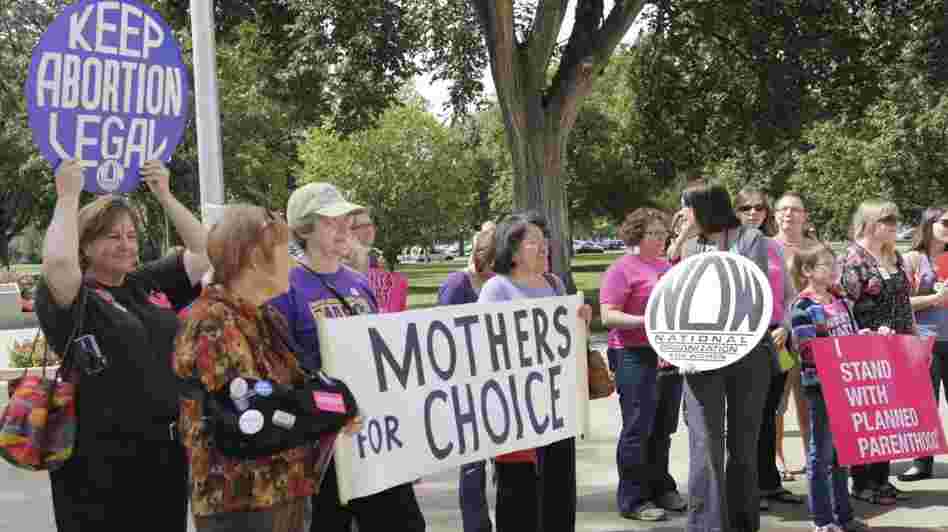 Protesters against new regulations limiting abortion rights rally outside the Statehouse in Topeka, Kan., last Sept.