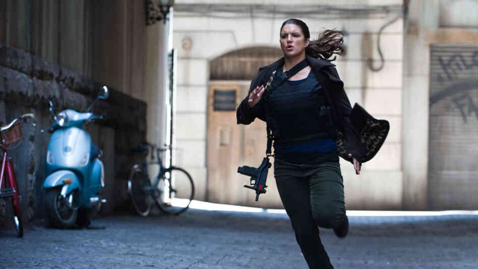 Mixed martial arts fighter Gina Carano stars as Mallory Kane, a highly trained covert operative, in a twisty, tautly wrought thriller. Mixed martial arts fighter Gina Carano stars as Mallory Kane, a highly trained covert operative, in a twisty, tautly wrought thriller.