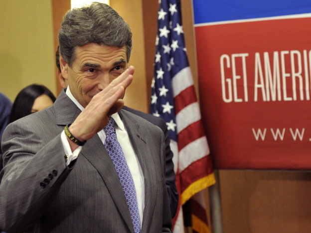 Texas Gov. Rick Perry salutes after announcing that he is suspending his campaign as a Republican presidential candidate.