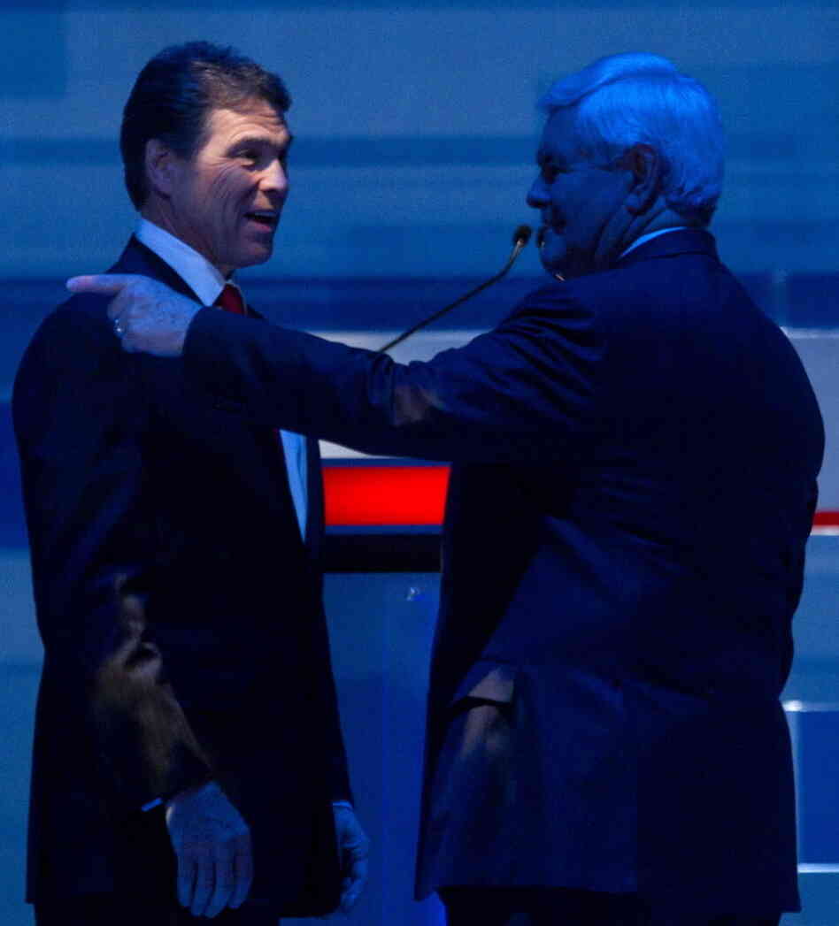 Texas Gov. Rick Perry, left, and former House Speaker Newt Gingrich on Monday (Jan. 16, 2012) in Myrtle Beach, S.C. Reports this morning say Perry will drop out of the GOP presidential race and endorse Gingrich.
